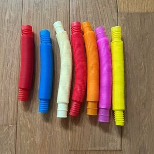 Lot of 7 Pull and Pop Fidget Tubes Colorful Assortment Childrens Toy